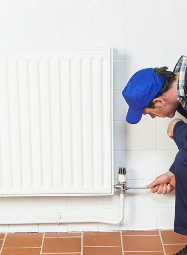 engineer installing central heating
