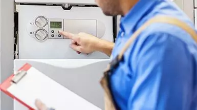 engineer inspecting a boiler